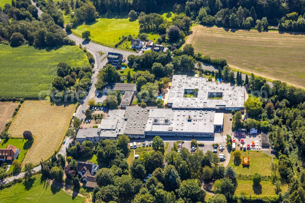 Aerial photograph Asbeck - Ground, administration and basis of the charitable organization Werkstatt Asbeck AWO Werkstattverbund on street Neuenlander Strasse in Asbeck in the state North Rhine-Westphalia, Germany