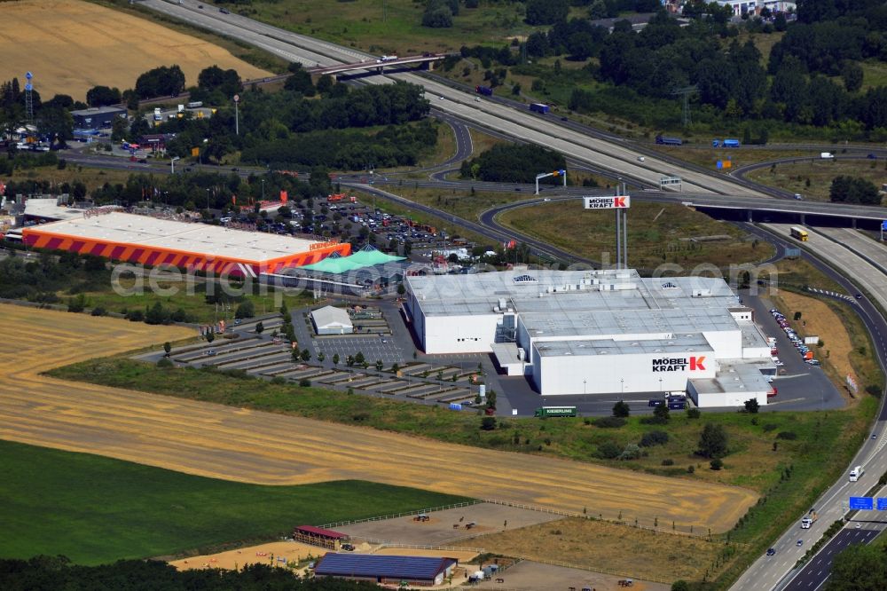 Vogelsdorf from the bird's eye view: Premises of the business park, multi-center and shopping center at the motorway Vogelsdorf in Brandenburg