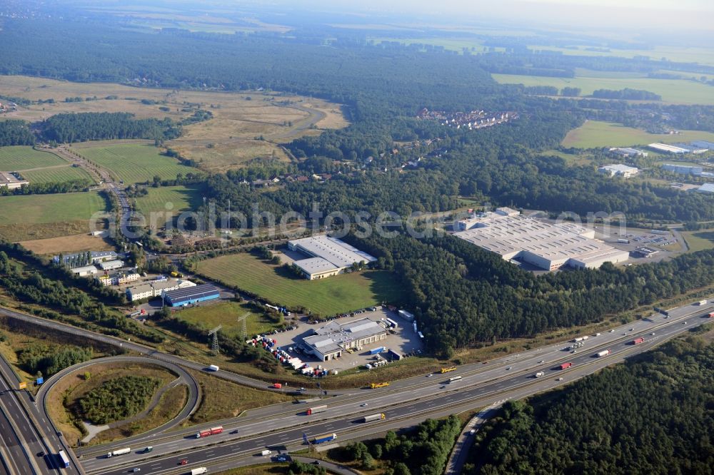 Aerial photograph Ludwigsfelde - View at the site of the industrial park Am Birkengrund in Ludwigsfelde in the federal state of Brandenburg. Among other the company MTU, Mercedes-Benz Ludwigsfelde GmbH and Thyssen-Krupp are settled here. Operators for the industrial park east are the GESA society of development and renovation of abandoned sites mbH and for the industrial park west the IPG Infrastructure and Project Development Company