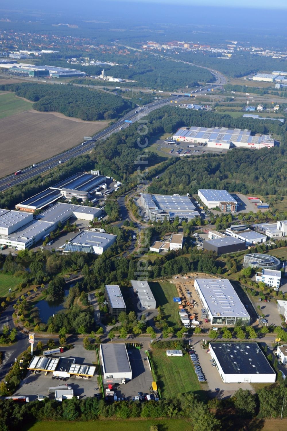 Ludwigsfelde from above - View at the site of the industrial park Am Birkengrund in Ludwigsfelde in the federal state of Brandenburg. Among other the company MTU, Mercedes-Benz Ludwigsfelde GmbH and Thyssen-Krupp are settled here. Operators for the industrial park east are the GESA society of development and renovation of abandoned sites mbH and for the industrial park west the IPG Infrastructure and Project Development Company