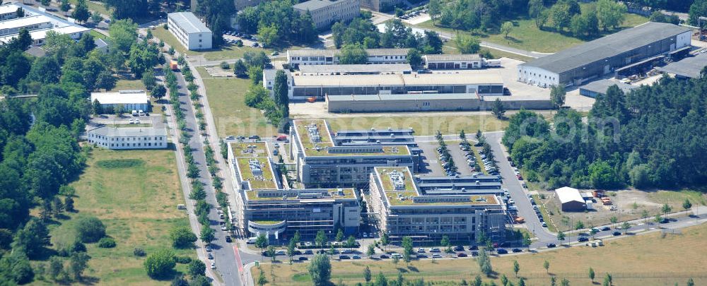 Berlin from above - Blick auf das Gelände des Innovationspark Wuhlheide auf dem ehemaligen Gelände des Ministeriums für Wissenschaft und Technik der DDR. Seit seiner Gründung im Jahr 1990 als erstes Technologie- und Gründerzentrum der neuen Bundesländer hat sich der IWP in Berlin zu einem wichtigen Gewerbe-Campus des Bezirks Treptow-Köpenick entwickelt.Betreiber ist die IMG mbH Innovationspark Wuhlheide Managementgesellschaft. The site of innovation Wuhlheide on the former site of the Ministry of Science and Technology of the GDR.