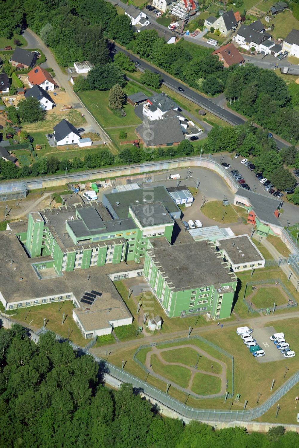 Fröndenberg/Ruhr from the bird's eye view: Prison premises and secure fencing of the JVA - correctional hospital - prison hospital in Froendenberg/Ruhr in the state North Rhine-Westphalia