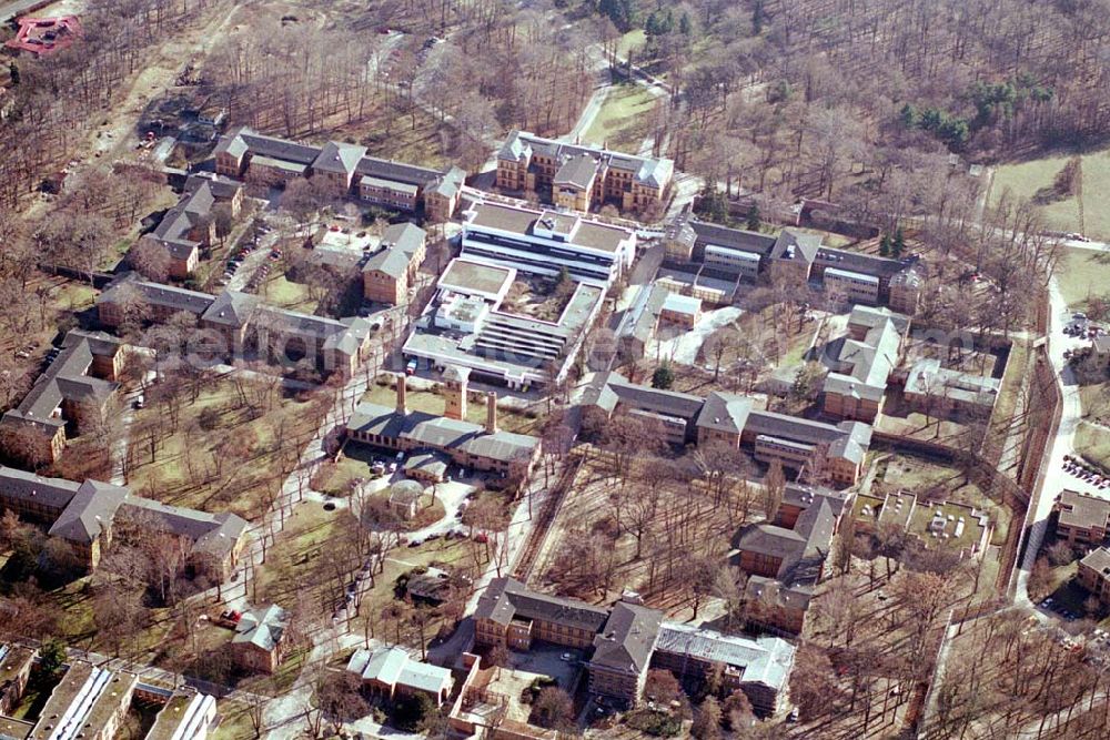 Berlin - Reinickendorf from the bird's eye view: Gelände der Karl-Bonhoeffer-Nervenklinik am gleichnamigen S-und U-Bahnhof an der Oranienburger Straße / Eichborndamm in Berlin Reinickendorf, nordöstlich des Flughafens Berlin-Tegel.