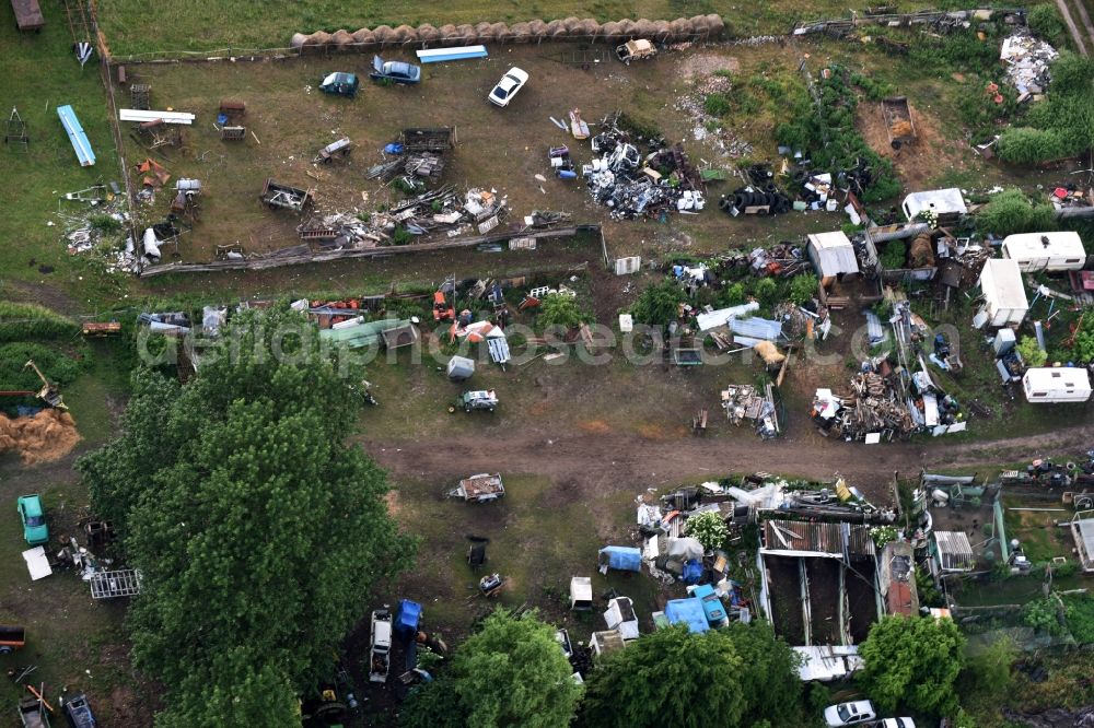 Aerial photograph Kremmen - Site of the landfill and scrap yard to Autowrack- disposal and disassembly for replacement commercial on Poststrasse in Kremmen in the state Brandenburg