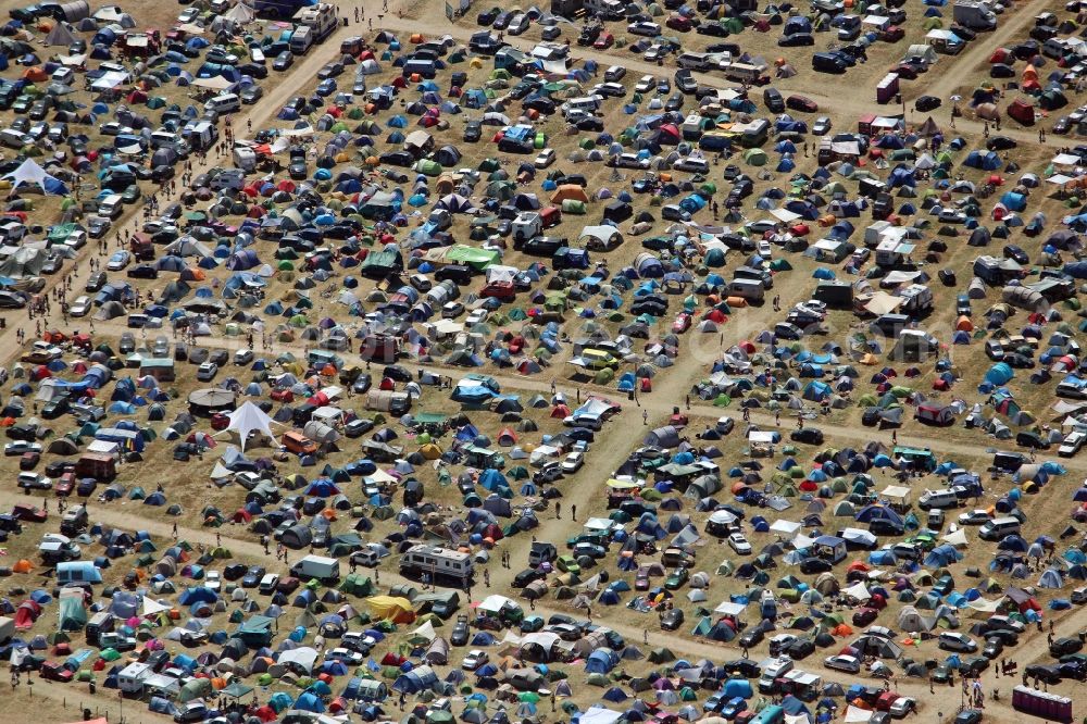 Grünefeld from the bird's eye view: Participants in the Nation of Godwana- music festival on the event concert area in Gruenefeld in the state Brandenburg