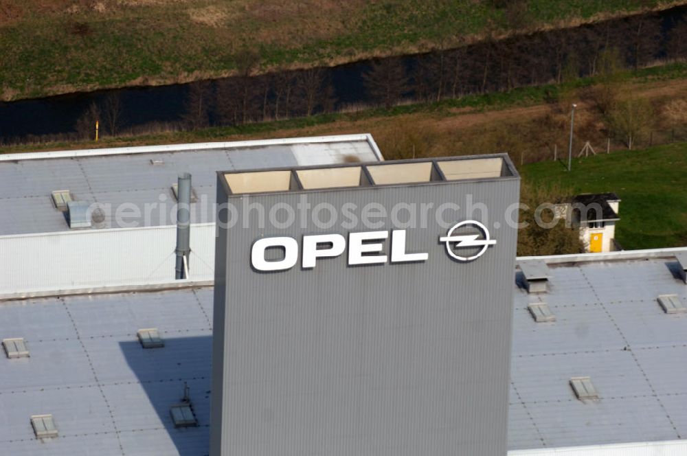 Aerial photograph EISENACH - Blick auf das Gelände des OPEL-Werkes Eisenach. Rund 1.900 Mitarbeiter produzieren in Thüringen den neuen Corsa. Die Opel Eisenach GmbH arbeitet seit 1992 mit modernsten Produktionsanlagen und -methoden. Grundlegend sind dafür die fünf Prinzipien: Standardisierung, kurze Durchlaufzeiten, Qualität von Anfang an, kontinuierliche Verbesserung und Einbeziehung der Mitarbeiter. Anschrift: Adam-Opel-Str. 100 in 99817 Eisenach, Tel.: 03691 66-0