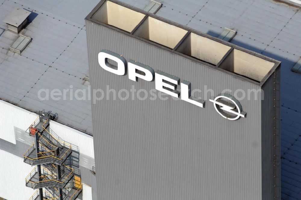 Aerial photograph EISENACH - Blick auf das Gelände des OPEL-Werkes Eisenach. Rund 1.900 Mitarbeiter produzieren in Thüringen den neuen Corsa. Die Opel Eisenach GmbH arbeitet seit 1992 mit modernsten Produktionsanlagen und -methoden. Grundlegend sind dafür die fünf Prinzipien: Standardisierung, kurze Durchlaufzeiten, Qualität von Anfang an, kontinuierliche Verbesserung und Einbeziehung der Mitarbeiter. Anschrift: Adam-Opel-Str. 100 in 99817 Eisenach, Tel.: 03691 66-0