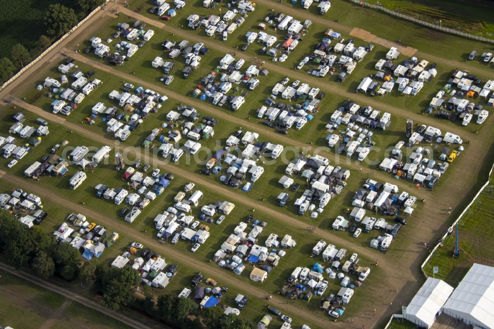 Weeze from the bird's eye view: Participants in the PAROOKAVILLE - Electronic Music Festival music festival on the event concert area in Weeze in the state North Rhine-Westphalia, Germany