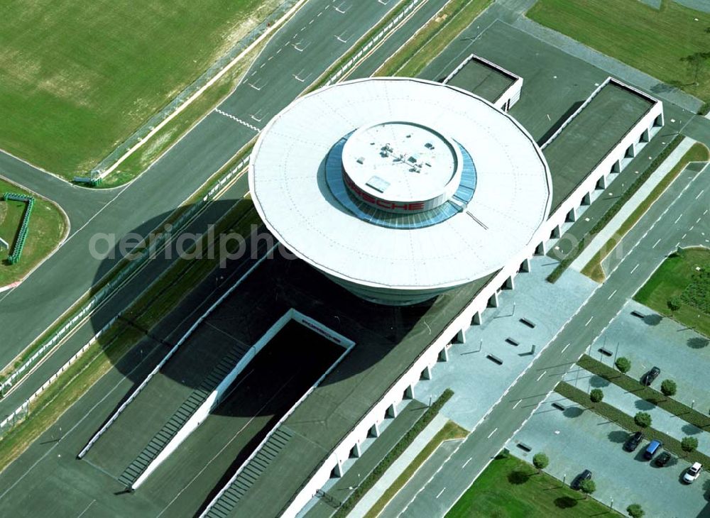 Aerial photograph Leipzig / Sachsen - 07.09.2002 Gelände der PORSCHE AG in Leipzig. Werksgelände der Tochtergesellschaft Porsche Leipzig GmbH mit dem 32 Meter hohen, kegelförmigen Zentralgebäude und der Teststrecke.