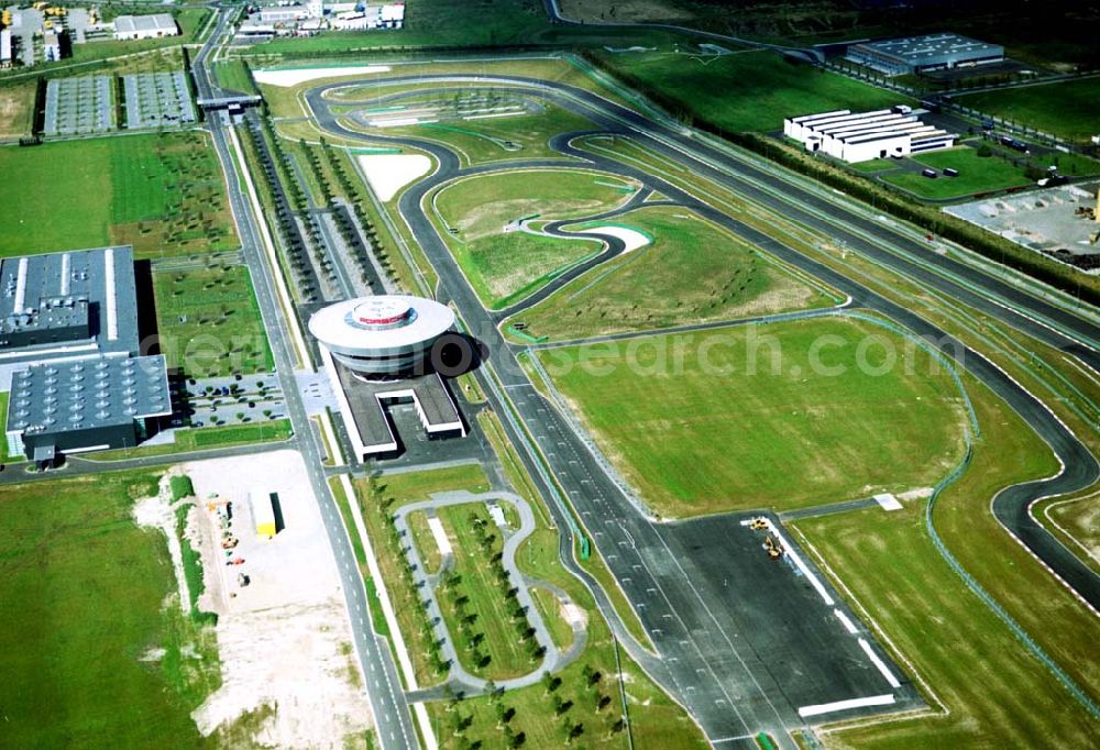 Aerial photograph Leipzig / Sachsen - 07.09.2002 Gelände der PORSCHE AG in Leipzig. Werksgelände der Tochtergesellschaft Porsche Leipzig GmbH mit dem 32 Meter hohen, kegelförmigen Zentralgebäude und der Teststrecke.