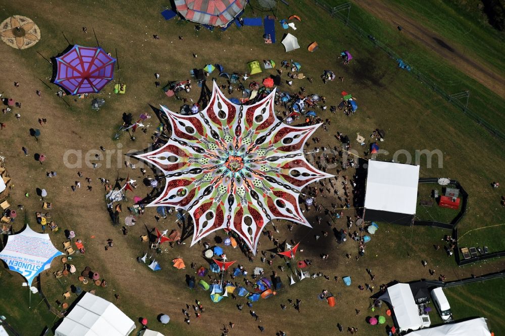 Eldena from the bird's eye view: Participants in the Psychedelic Circus Festival - music festival on the event concert area in Eldena in the state Mecklenburg - Western Pomerania