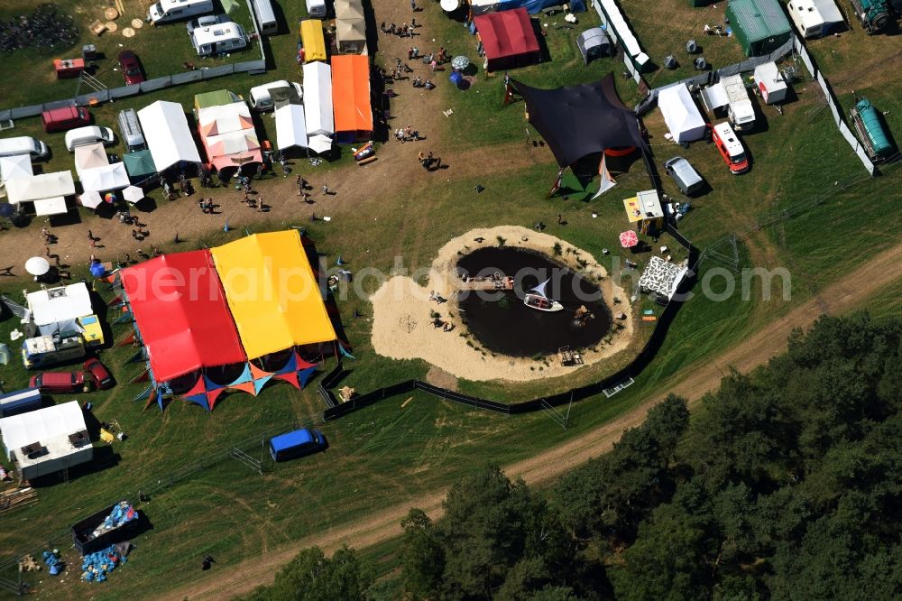 Eldena from the bird's eye view: Participants in the Psychedelic Circus Festival - music festival on the event concert area in Eldena in the state Mecklenburg - Western Pomerania