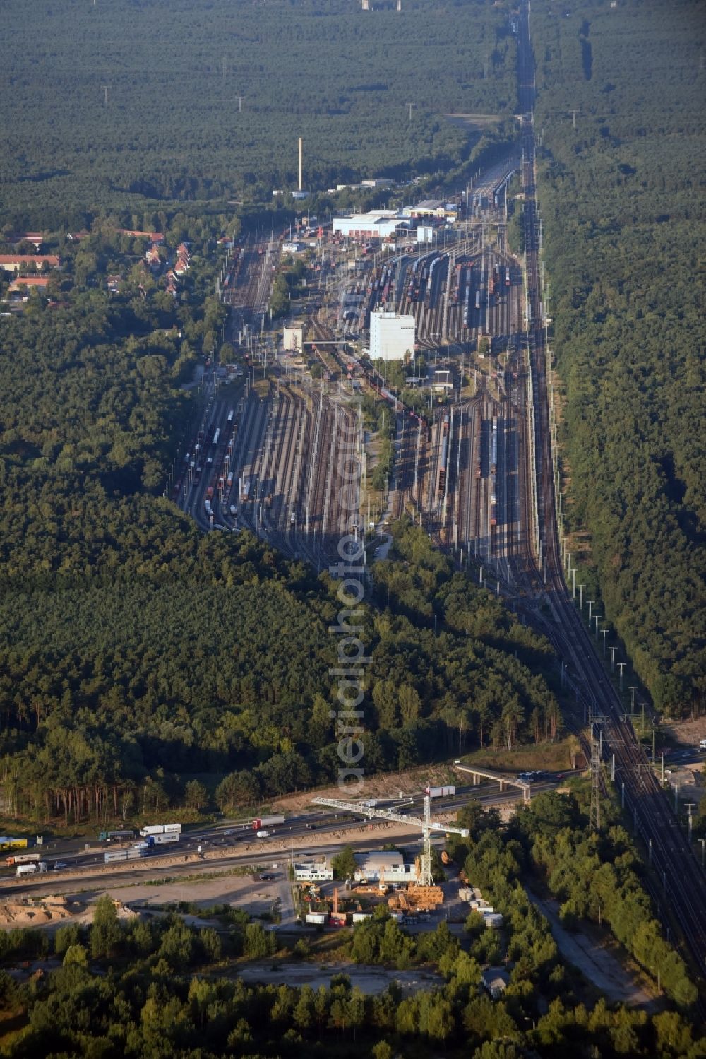 Seddiner See from above - Compound and facilities of Seddin Station and its rail tracks in the borough of Seddiner See in the state of Brandenburg. The train station Seddin is a railway station in Neuseddin in Brandenburg. It is one of the most important railway yards at DB InfraGO AG in East Germany