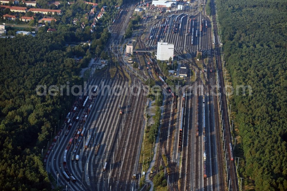 Seddiner See from above - Compound and facilities of Seddin Station and its rail tracks in the borough of Seddiner See in the state of Brandenburg. The train station Seddin is a railway station in Neuseddin in Brandenburg. It is one of the most important railway yards at DB InfraGO AG in East Germany