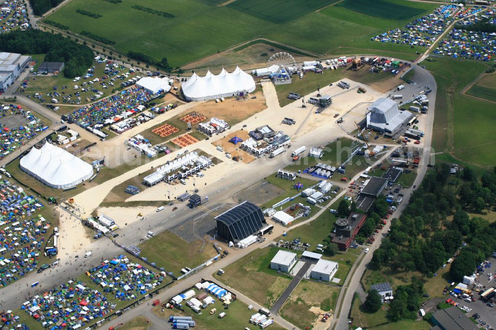 Neuhausen ob Eck from above - Participants in the Southside Music Festival with camping - tents and caravans on the event concert site of the airfield on street Take-Off Gewerbepark in Neuhausen ob Eck in the state Baden-Wuerttemberg, Germany