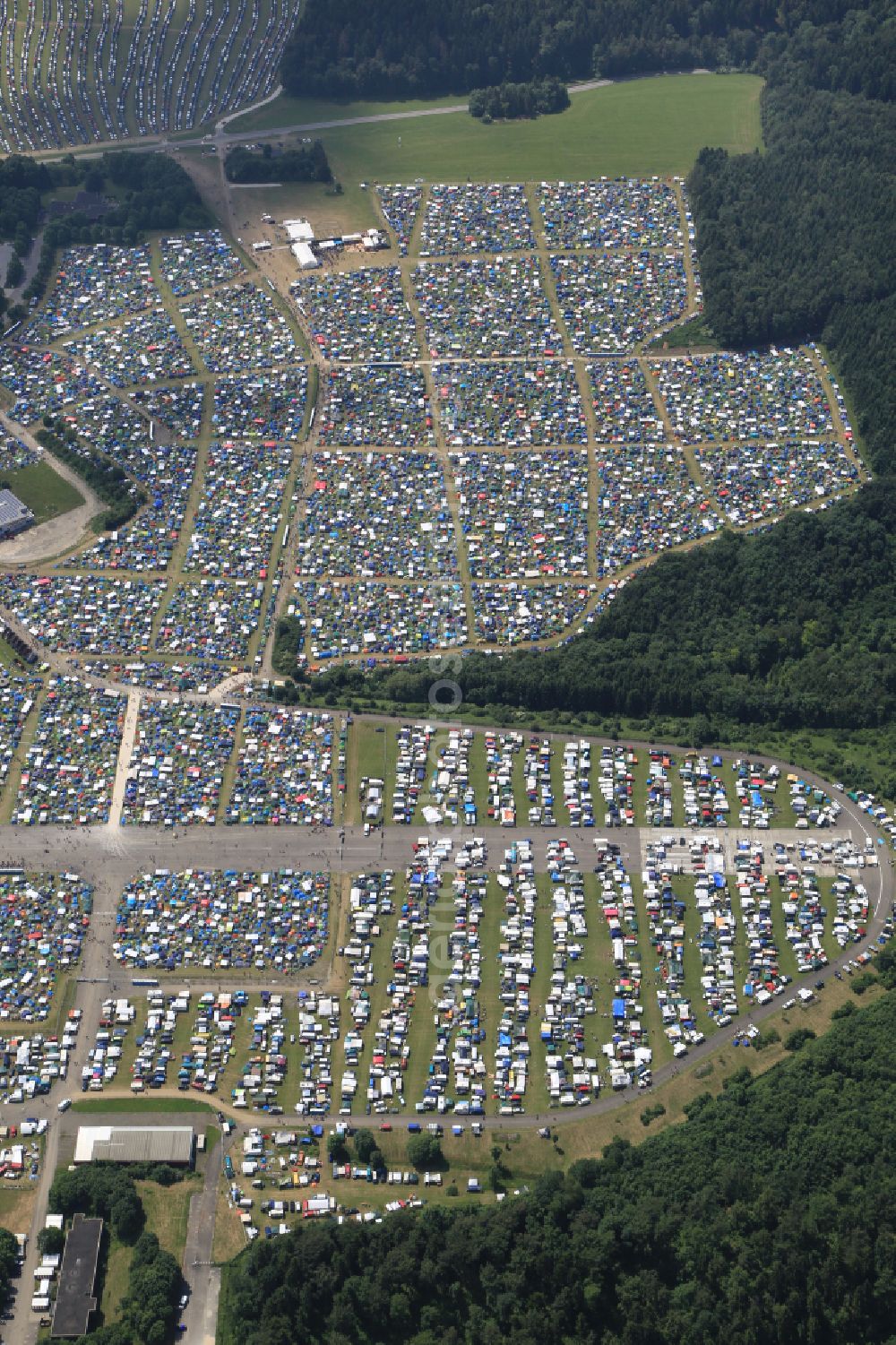 Neuhausen ob Eck from above - Participants in the Southside Music Festival with camping - tents and caravans on the event concert site of the airfield on street Take-Off Gewerbepark in Neuhausen ob Eck in the state Baden-Wuerttemberg, Germany