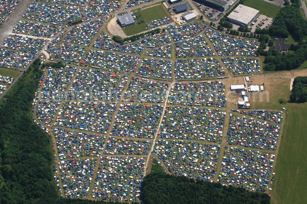 Aerial image Neuhausen ob Eck - Participants in the Southside Music Festival with camping - tents and caravans on the event concert site of the airfield on street Take-Off Gewerbepark in Neuhausen ob Eck in the state Baden-Wuerttemberg, Germany