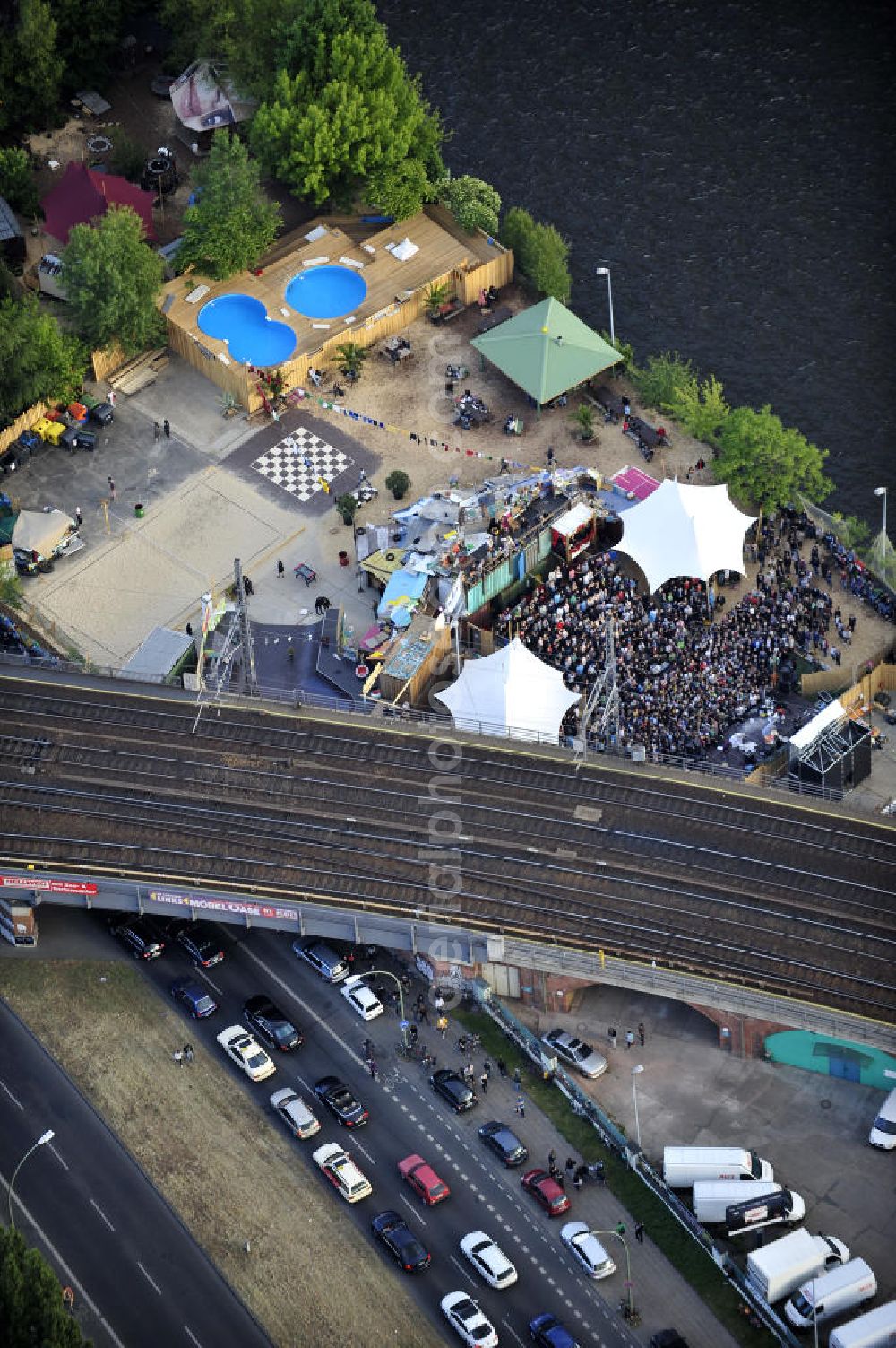 Berlin from the bird's eye view: Blick auf das Gelände der Strandbar BAR25 an der Holzmarktstraße am Spreeufer in Berlin-Mitte, einem beliebten Szene-Treffpunkt für Insider und Touristen. View of the site of the Bar25 on the river Spree in Berlin-Mitte, a popular meeting point for scene insiders and tourists.