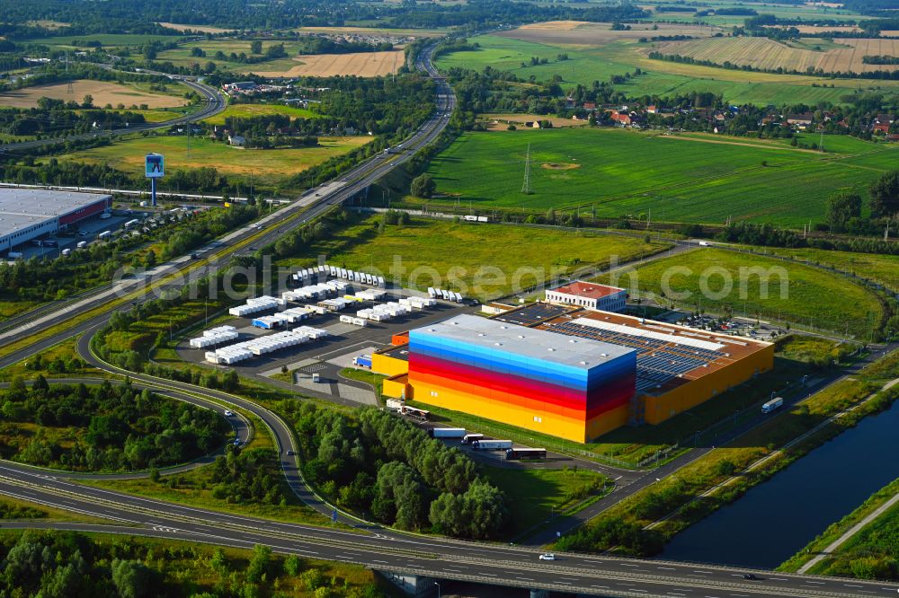 Wustermark from the bird's eye view: High-bay warehouse building complex and logistics center on the premises dm VZ Verteilerzentrum in Wustermark in the state Brandenburg, Germany