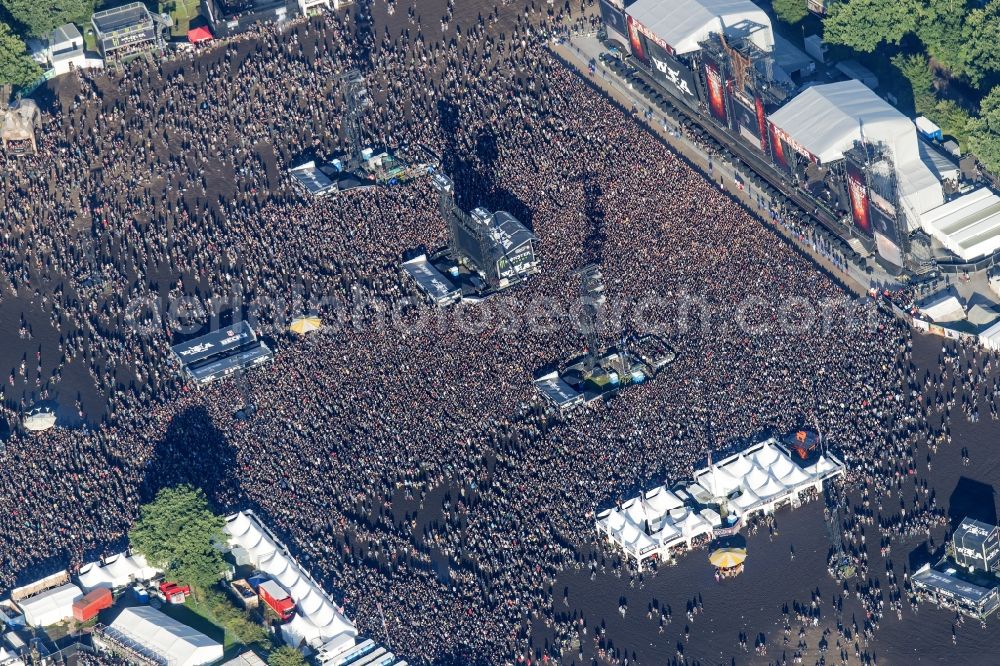 Wacken from the bird's eye view: Participants in the Wacken music festival on the event concert area in Wacken in the state Schleswig-Holstein, Germany