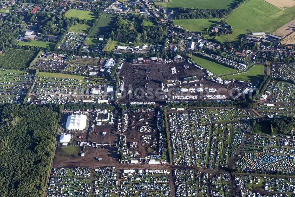 Aerial photograph Wacken - Participants in the Wacken music festival on the event concert area in Wacken in the state Schleswig-Holstein, Germany