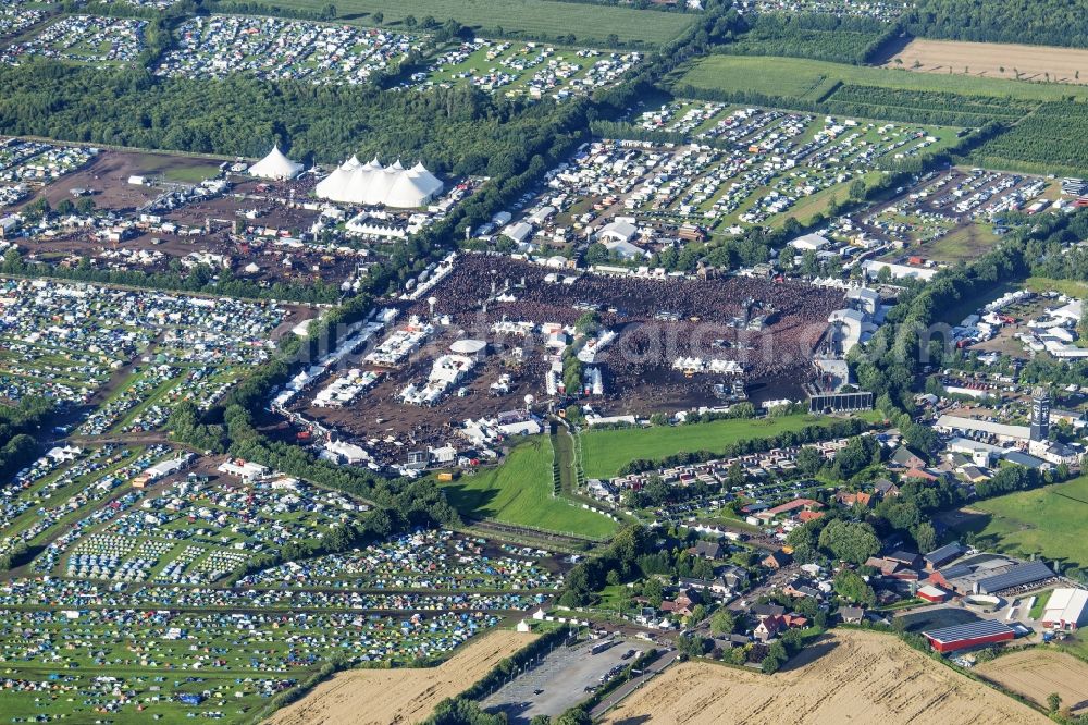 Wacken from the bird's eye view: Participants in the Wacken music festival on the event concert area in Wacken in the state Schleswig-Holstein, Germany