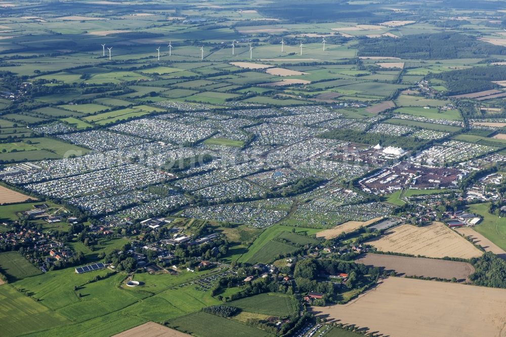 Aerial photograph Wacken - Participants in the Wacken music festival on the event concert area in Wacken in the state Schleswig-Holstein, Germany