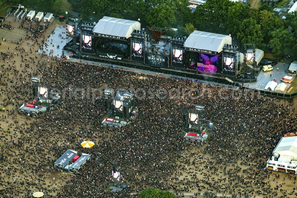 Aerial image Wacken - Participants in the Wacken music festival on the event concert area in Wacken in the state Schleswig-Holstein, Germany