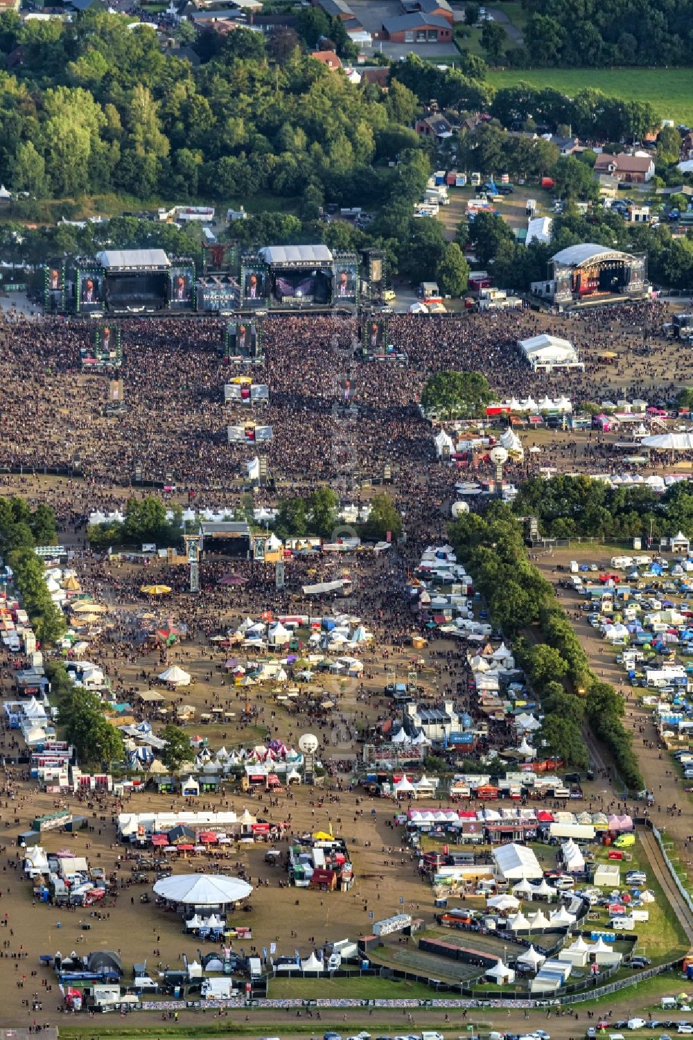 Aerial image Wacken - Participants in the Wacken music festival on the event concert area in Wacken in the state Schleswig-Holstein, Germany