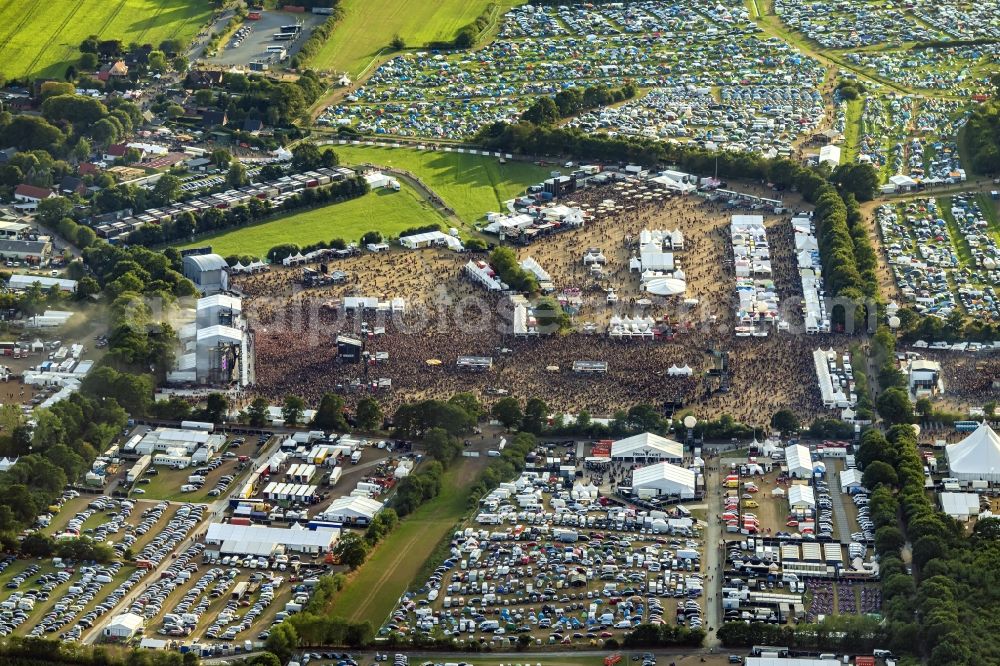 Aerial photograph Wacken - Participants in the Wacken music festival on the event concert area in Wacken in the state Schleswig-Holstein, Germany