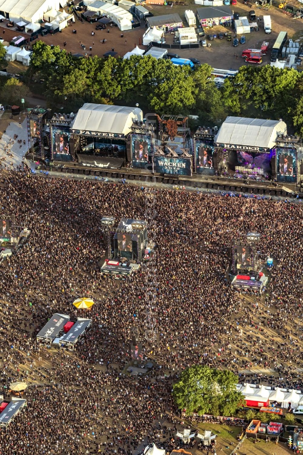 Aerial image Wacken - Participants in the Wacken music festival on the event concert area in Wacken in the state Schleswig-Holstein, Germany