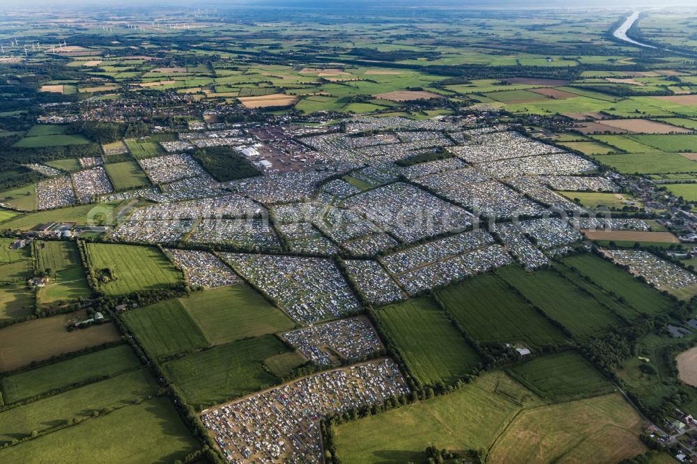 Aerial photograph Wacken - Participants in the Wacken music festival on the event concert area in Wacken in the state Schleswig-Holstein, Germany