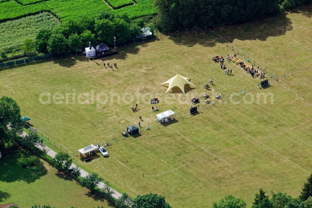 Neuried from the bird's eye view: Participants in the WonderWoods music festival on the event concert area in Neuried in the state Bavaria, Germany