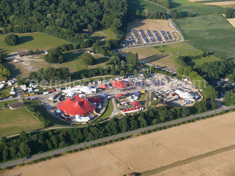 Freiburg from above - Blick auf das Gelände des ZMF Zelt-Musik-Festival Freiburg zur Eröffnung im 25. Jahr seines Bestehens. Das Zelt-Musik-Festival ist eines der ältesten Zeltfestivals in Europa. Sein einmalige Mischung aus Zeltstadt, Natur und Kultur und ein hochkarätiges und vielfältiges Programm haben das Festival zu einem Begriff in der internationalen Festivallandschaft werden lassen. View of the site of the tent ZMF Freiburg Music Festival opening in the 25th Years of its existence. The tent-Music-Festival is one of the oldest tent festivals in Europe. His unique blend of tent city, nature and culture and a high caliber and diverse program have turned the festival into a household name in the international festival landscape.