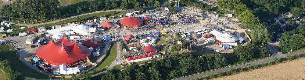 Aerial photograph Freiburg - Blick auf das Gelände des ZMF Zelt-Musik-Festival Freiburg zur Eröffnung im 25. Jahr seines Bestehens. Das Zelt-Musik-Festival ist eines der ältesten Zeltfestivals in Europa. Sein einmalige Mischung aus Zeltstadt, Natur und Kultur und ein hochkarätiges und vielfältiges Programm haben das Festival zu einem Begriff in der internationalen Festivallandschaft werden lassen. View of the site of the tent ZMF Freiburg Music Festival opening in the 25th Years of its existence. The tent-Music-Festival is one of the oldest tent festivals in Europe. His unique blend of tent city, nature and culture and a high caliber and diverse program have turned the festival into a household name in the international festival landscape.