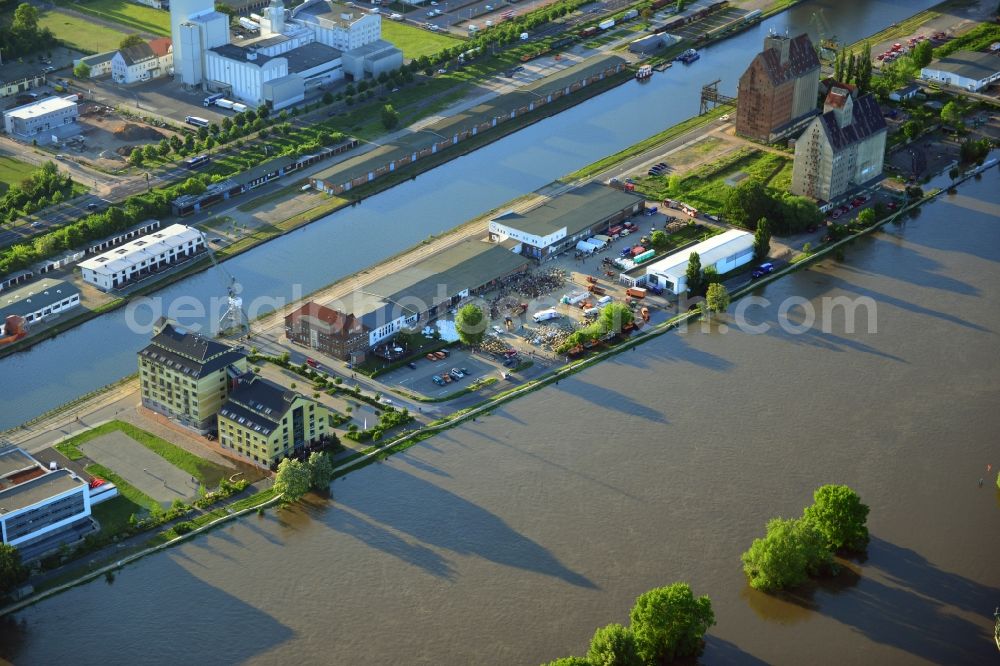 Magdeburg from above - Joint filling / filling sandbags on a commercial complex at the Werner-Heisenberg-road to prepare for flood protection on the banks of the Elbe in Magdeburg in Saxony-Anhalt