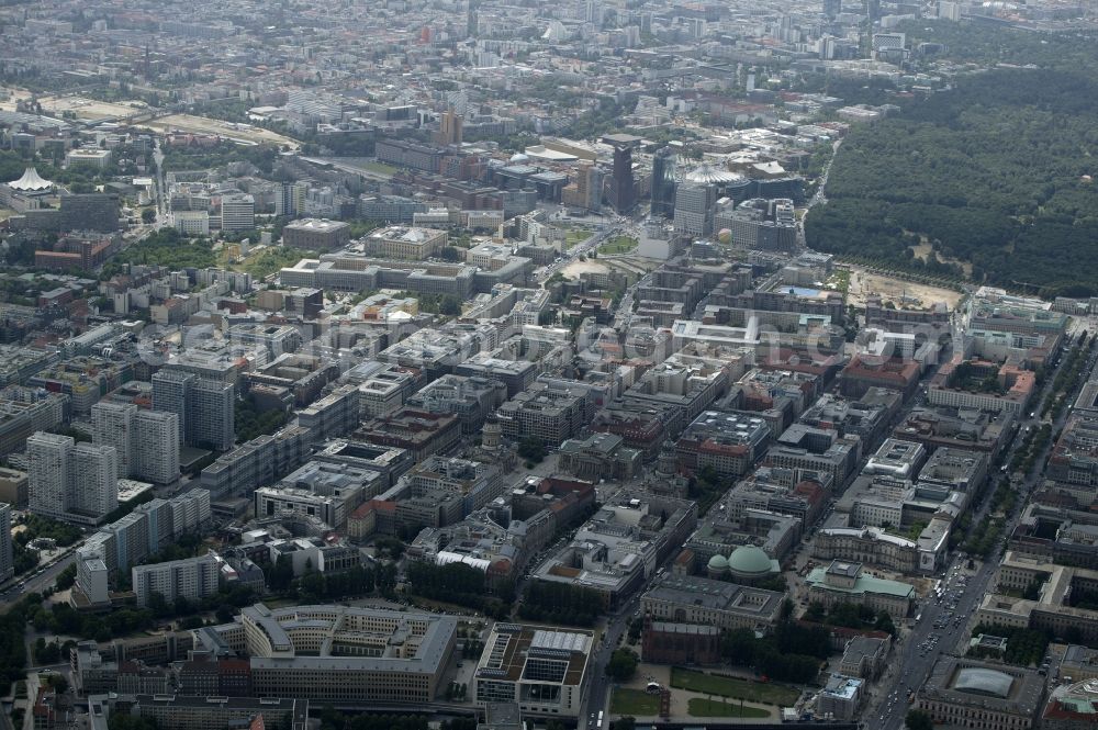 Berlin from above - Like a chess board, bounded by rectangular street is the Friedrichstadt part of Berlin-Mitte in Berlin between State of Unter den Linden and Leipziger Strasse. In this area, which is one of the top addresses of trade, economy, culture and tourism in the capital there are many attractions. At the Gendarmenmarkt, it is the ensemble of Konzerthaus Berlin, German Cathedral and French Cathedral. You can see the St. Hedwig's Cathedral, the Friedrichswerder Church and the Ministry of Foreign Affairs. On August-Bebel-square stands the State Opera and a faculty building of the Humboldt University. In the background the skyscrapers on Potsdamer Platz can be seen