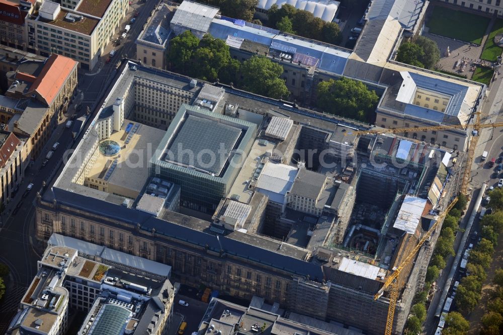 Berlin from above - View at the overhaul and modernization of the State Library of Berlin Unter den Linden in the district Mitte in Berlin. Currently in the first phase arises a new reading roomas a glass cube, a rare book reading room, a safe magazine for the special collections also incurred is the north old building which will be completely renovated. In the second phase then will arise a Freehand magazin, a treasury, a library museum, an exhibition area, a catering facility and the northern part of the old building will be completely renovated. The activities are carried out by the architect and museum designer HG Merz, builder is the covenant. The building is a protected monument