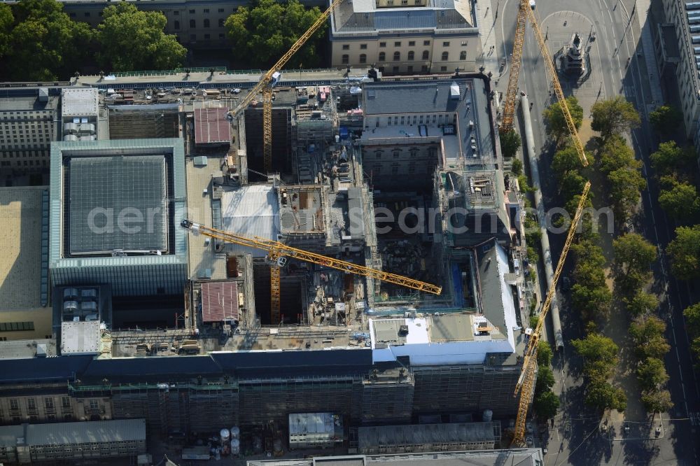 Berlin from above - View at the overhaul and modernization of the State Library of Berlin Unter den Linden in the district Mitte in Berlin. Currently in the first phase arises a new reading roomas a glass cube, a rare book reading room, a safe magazine for the special collections also incurred is the north old building which will be completely renovated. In the second phase then will arise a Freehand magazin, a treasury, a library museum, an exhibition area, a catering facility and the northern part of the old building will be completely renovated. The activities are carried out by the architect and museum designer HG Merz, builder is the covenant. The building is a protected monument