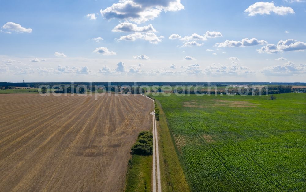 Aerial photograph Velten - Plowed field next to a vegetable field in Velten in the state Brandenburg, Germany