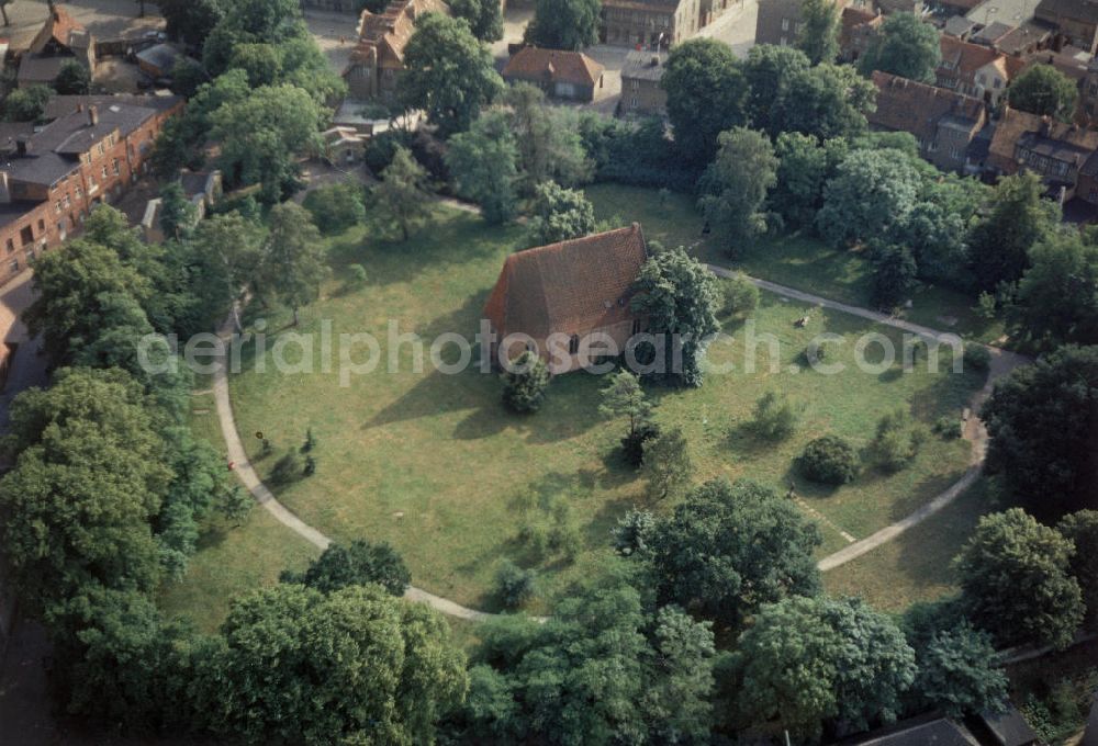 Aerial image Güstrow - Blick auf die Gertrudenkapelle von Güstrow in Mecklenburg-Vorpommern. Die Kapelle ist ein mit Backstein verblendetes spätgotisches Bauwerk aus dem 15. Jahrhundert. 1953 wurde in der Gertrudenkapelle eine Gedenkstätte für Ernst Barlach errichtet. Hier werden Holzskulpturen und weitere bildhauerische Werke von Barlach gezeigt. View of the Gertrude Chapel Güstrow in Mecklenburg-Western Pomerania. The chapel is a late Gothic building with a deluded brick structure from the 15th Century. In 1953 a memorial to Ernst Barlach was etablished in the chapel. Wood sculptures and other sculptural works by Barlach are shown here.