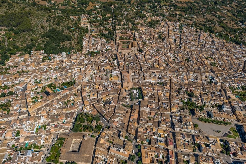 Pollenca from above - City area with outside districts and inner city area in Pollenca in Balearische Insel Mallorca, Spain