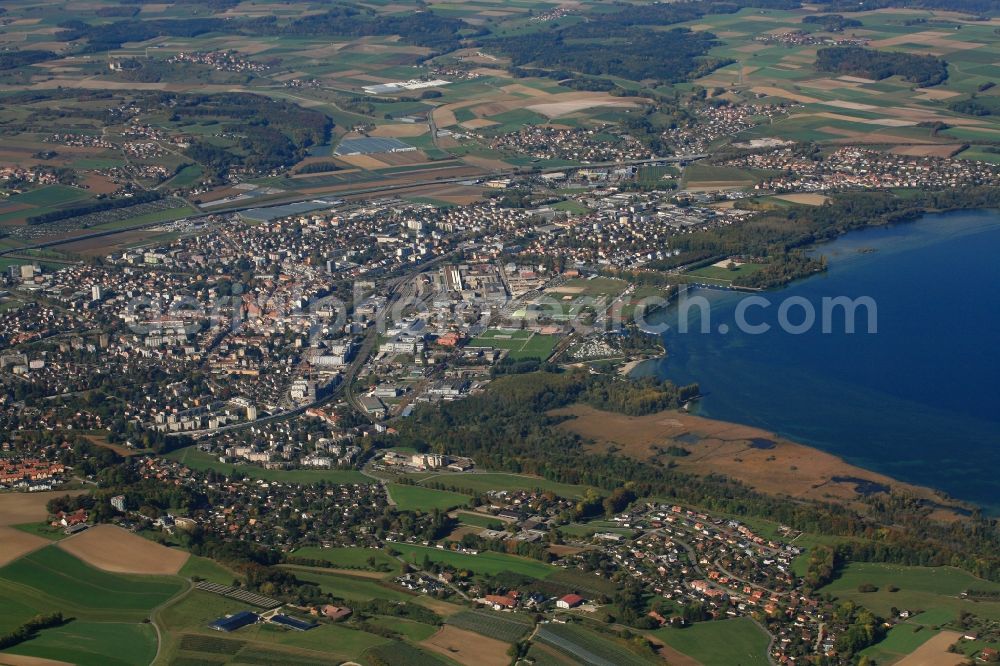 Yverdon-les-Bains from above - City area with outside districts and inner city area in Yverdon-les-Bains at the Lake Neuchatel in the canton Vaud, Switzerland