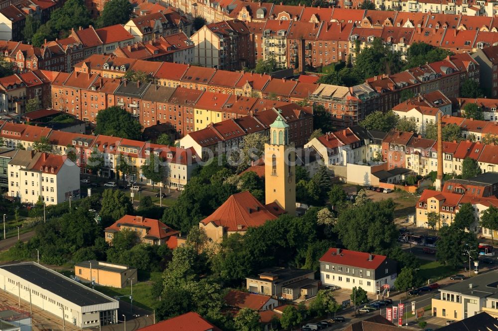 Erfurt from the bird's eye view: Commercial and residential buildings in the Magdeburg Avenue, and the Evangelical Lutheran Church in St. John's suburb in Erfurt in Thuringa