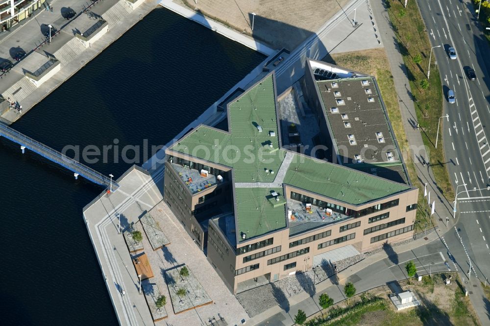 Rostock from the bird's eye view: Construction site to build a new office and commercial building of Centogene AG Am Strande on Holzhalbinsel in Rostock in the state Mecklenburg - Western Pomerania, Germany