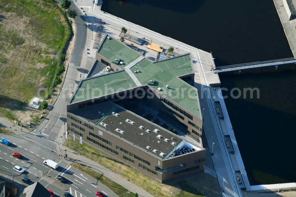 Rostock from the bird's eye view: Construction site to build a new office and commercial building of Centogene AG Am Strande on Holzhalbinsel in Rostock in the state Mecklenburg - Western Pomerania, Germany