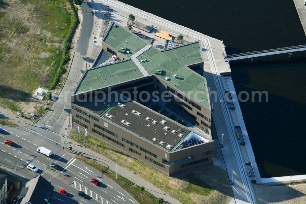 Aerial image Rostock - Construction site to build a new office and commercial building of Centogene AG Am Strande on Holzhalbinsel in Rostock in the state Mecklenburg - Western Pomerania, Germany