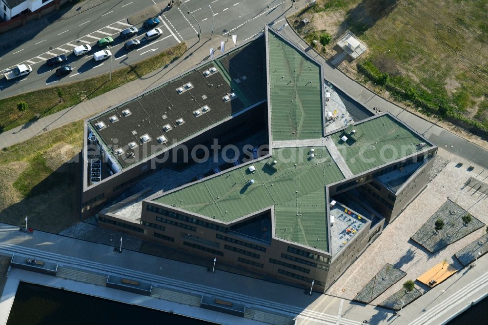 Rostock from above - Construction site to build a new office and commercial building of Centogene AG Am Strande on Holzhalbinsel in Rostock in the state Mecklenburg - Western Pomerania, Germany