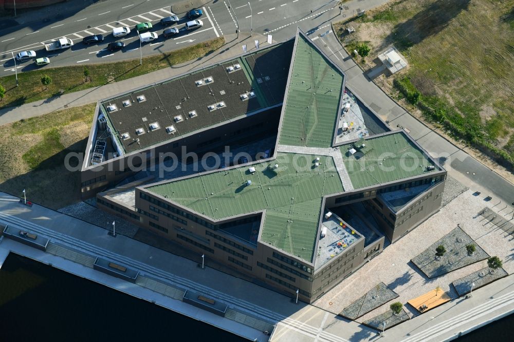 Rostock from the bird's eye view: Construction site to build a new office and commercial building of Centogene AG Am Strande on Holzhalbinsel in Rostock in the state Mecklenburg - Western Pomerania, Germany