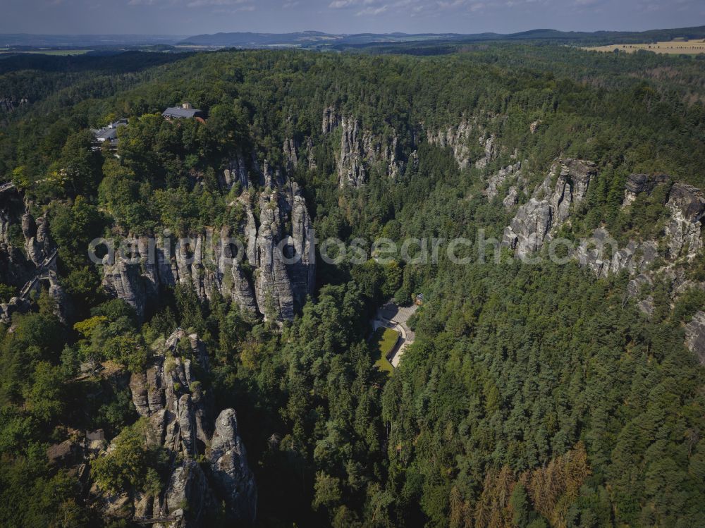 Rathen from above - Rock massif and rock formation and sandstone rocks in the Elbe Sand Mountains on the road Wehlener Weg in Rathen Bastei area in the federal state of Saxony, Germany